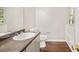 Bathroom with a granite countertop and tile backsplash at 2240 Creekside Vw, Decatur, GA 30035