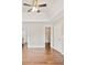 Primary bedroom showcases tray ceiling, fan, and open entry to ensuite bath at 2240 Creekside Vw, Decatur, GA 30035