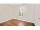 Bright bedroom with wood floors, neutral paint, and natural light streaming through the window at 2240 Creekside Vw, Decatur, GA 30035