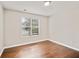 Cozy bedroom with wood floors, natural light, and a view of the surrounding neighborhood at 2240 Creekside Vw, Decatur, GA 30035