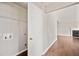 Hallway view towards the living room with hardwood floors and light grey walls at 2240 Creekside Vw, Decatur, GA 30035