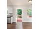 Open kitchen view with stainless steel appliances, wood floors, and access to deck at 2240 Creekside Vw, Decatur, GA 30035