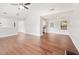 Open floor plan with hardwood floors connecting the living room and kitchen at 2240 Creekside Vw, Decatur, GA 30035