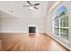 Open living room with vaulted ceiling, fireplace, and large arched window at 2240 Creekside Vw, Decatur, GA 30035
