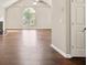Open living room with large window, fireplace, and hardwood floors at 2240 Creekside Vw, Decatur, GA 30035