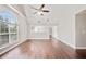Spacious living room featuring vaulted ceilings, a large window, and hardwood floors at 2240 Creekside Vw, Decatur, GA 30035