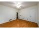 Well-lit bedroom with hardwood floors, white walls, and base-molding at 4324 Japonica Sw Ct, Lilburn, GA 30047