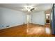 Bedroom with hardwood floors, ample lighting, base-molding and ensuite bathroom access at 4324 Japonica Sw Ct, Lilburn, GA 30047