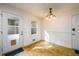 Eat in Dining Area with exterior access, chandelier, with tile flooring at 4324 Japonica Sw Ct, Lilburn, GA 30047