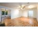 Open living room with wood floors, leading to the dining room and offering ample space at 4324 Japonica Sw Ct, Lilburn, GA 30047