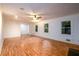 Bright living room with wood floors and large windows providing plenty of natural light at 4324 Japonica Sw Ct, Lilburn, GA 30047