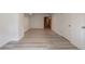 Spacious basement features light gray flooring and white walls for a clean, modern look at 4408 Brandon Ne Ct, Marietta, GA 30066