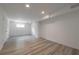 Finished basement with hardwood floors, neutral walls, and a window at 4408 Brandon Ne Ct, Marietta, GA 30066
