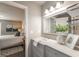 Bathroom with double vanity and framed mirror, looking into a bedroom at 4408 Brandon Ne Ct, Marietta, GA 30066