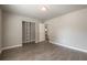 Bedroom with hardwood floors, neutral walls, and a closet with shelving at 4408 Brandon Ne Ct, Marietta, GA 30066