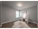 Cozy bedroom setup with stylish seating, a cow hide rug and natural light at 4408 Brandon Ne Ct, Marietta, GA 30066