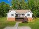 Charming home featuring a front porch with a brick foundation and well-manicured lawn at 4408 Brandon Ne Ct, Marietta, GA 30066