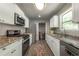 Well-equipped kitchen featuring stainless steel appliances, ample storage, and adjacent laundry area at 4408 Brandon Ne Ct, Marietta, GA 30066