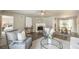 Open-concept living area featuring a fireplace, dining space, and seamless flow to the bedroom at 4408 Brandon Ne Ct, Marietta, GA 30066