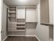 Well-organized walk-in closet with custom shelving and drawers at 4408 Brandon Ne Ct, Marietta, GA 30066