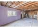 Unfinished basement showing a blank canvas for personalized renovation with a window at 143 Longview Rd, Fayetteville, GA 30214