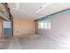 Unfinished basement with a partially painted walls, a window and cement floors ready for flooring at 143 Longview Rd, Fayetteville, GA 30214