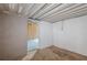 Unfinished basement showing concrete walls and ceiling, leading to a space ready for renovation and design at 143 Longview Rd, Fayetteville, GA 30214