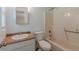 Well-lit bathroom features a shower and tub combination and a sink vanity with countertop at 143 Longview Rd, Fayetteville, GA 30214