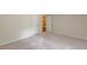 A carpeted bedroom features a closet and is painted in neutral tones at 143 Longview Rd, Fayetteville, GA 30214