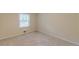The bedroom is carpeted and bright with neutral paint and a large window at 143 Longview Rd, Fayetteville, GA 30214