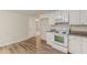 Kitchen with white cabinets, granite countertops, and stainless-steel appliances at 143 Longview Rd, Fayetteville, GA 30214