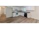 Kitchen features white cabinets, granite countertops, and stainless-steel appliances at 143 Longview Rd, Fayetteville, GA 30214