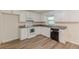 Kitchen with white cabinets, granite countertops, and stainless-steel appliances at 143 Longview Rd, Fayetteville, GA 30214