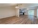 Open living room and kitchen layout with wood flooring and neutral paint at 143 Longview Rd, Fayetteville, GA 30214