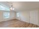 Light-filled living room with high ceilings, wood floors, and modern light fixtures at 143 Longview Rd, Fayetteville, GA 30214