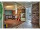 Unfinished basement featuring exposed brick, concrete floors, and an open layout, offering potential for customization and storage at 4002 Phylis Pl, Decatur, GA 30035