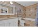 Detailed bathroom with decorative tiles, a bathtub, and an ornate vanity at 4002 Phylis Pl, Decatur, GA 30035