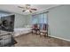 Cozy bedroom featuring a ceiling fan, a comfortable bed, and a TV at 4002 Phylis Pl, Decatur, GA 30035