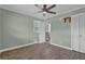 This cozy bedroom includes a ceiling fan, closet and doorway to an adjoining bathroom at 4002 Phylis Pl, Decatur, GA 30035