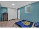 Bedroom with tile floors, a built-in wardrobe, and a window offering ample space and natural light at 4002 Phylis Pl, Decatur, GA 30035