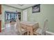 Charming dining room with tile floors and an elegant table setting adjoining a cozy living room at 4002 Phylis Pl, Decatur, GA 30035