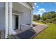 Covered entrance featuring white columns and a concrete walkway, offering a welcoming approach to the home at 4002 Phylis Pl, Decatur, GA 30035