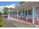 Charming front porch with decorative railings, string lights, and space for seating at 4002 Phylis Pl, Decatur, GA 30035