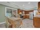 Well-lit kitchen with wooden cabinets, stainless steel appliances, and tile floors at 4002 Phylis Pl, Decatur, GA 30035