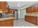 Traditional kitchen featuring granite countertops, tile backsplash, and wooden cabinetry at 4002 Phylis Pl, Decatur, GA 30035