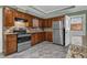 Kitchen features granite countertops, stainless steel appliances and beautiful wood cabinetry at 4002 Phylis Pl, Decatur, GA 30035