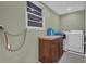 Laundry room featuring a cabinet, washer, dryer, and a window at 4002 Phylis Pl, Decatur, GA 30035