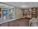 Living room area showcasing a display case, chairs, and doorway to the kitchen at 4002 Phylis Pl, Decatur, GA 30035