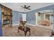 Open-concept living room with fireplace and hardwood floors, flowing into the dining area at 4002 Phylis Pl, Decatur, GA 30035