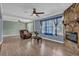 Living room showcasing hardwood floors, a fireplace, and an open layout to adjacent rooms at 4002 Phylis Pl, Decatur, GA 30035